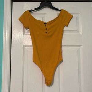 across the shoulder bodysuit